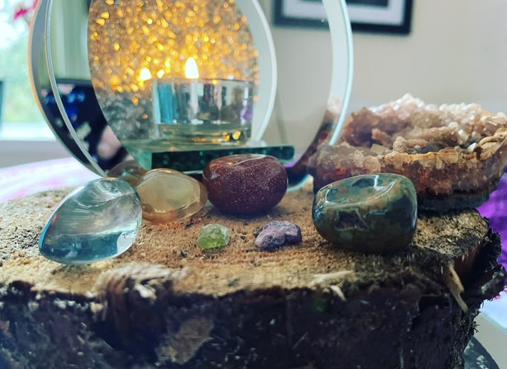 Crystal altar with singing bowl, geode and tumbled healing stones